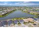 Wide aerial view of the community with a central lake at 9132 Bernini Pl, Sarasota, FL 34240