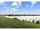 Scenic backyard view overlooking a serene lake, offering a tranquil and picturesque setting at 9132 Bernini Pl, Sarasota, FL 34240