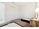 Bedroom with twin beds, carpet, closet and lamp at 9132 Bernini Pl, Sarasota, FL 34240