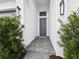 Close-up view of the front door with a well-designed walkway and neat landscaping at 9132 Bernini Pl, Sarasota, FL 34240