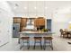 Bright kitchen features granite counters, stainless appliances, and counter seating at 9132 Bernini Pl, Sarasota, FL 34240