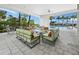 Inviting outdoor patio with comfortable seating, providing a relaxing space for gatherings and enjoying the outdoors at 9132 Bernini Pl, Sarasota, FL 34240