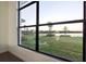 Large window offering scenic views of the lake and community at 9132 Bernini Pl, Sarasota, FL 34240