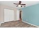 Bedroom with double door closet and ceiling fan at 1034 Pine Ridge Cir, Brandon, FL 33511