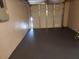 Clean, painted garage with closed door, and painted floor at 11608 Zimmerman Rd, Port Richey, FL 34668