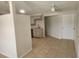 Kitchenette with neutral cabinets, stainless steel sink, and tile flooring at 11608 Zimmerman Rd, Port Richey, FL 34668