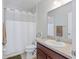 Clean bathroom with a shower/tub combo and vanity at 11905 Grand Kempston Dr, Gibsonton, FL 33534