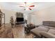 Living room with sectional sofa, TV, and wood floors at 1742 31St S St, St Petersburg, FL 33712