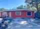 Red single-story house with a white door and small front yard at 1776 28Th N Ave, St Petersburg, FL 33713
