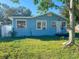 Light blue single-story house with a white door and yard at 1776 28Th N Ave, St Petersburg, FL 33713