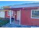 Red single story house with a white door and small front porch at 1776 28Th N Ave, St Petersburg, FL 33713