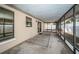 Covered screened porch with view of backyard at 1922 Sheffield Ct, Oldsmar, FL 34677