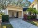 Inviting condo exterior featuring carport and landscaping at 2553 Forest Run Ct # 150A, Clearwater, FL 33761