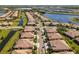 Aerial view of community with multiple homes and waterways at 309 Mystic Falls Dr, Apollo Beach, FL 33572