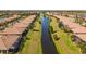 Aerial view of community featuring canal-front homes at 309 Mystic Falls Dr, Apollo Beach, FL 33572