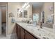 Double vanity bathroom with granite countertop and separate toilet area at 309 Mystic Falls Dr, Apollo Beach, FL 33572