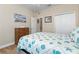 Light and airy bedroom with wood dresser and ceiling fan at 309 Mystic Falls Dr, Apollo Beach, FL 33572