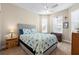 Cozy bedroom with a ceiling fan and plenty of natural light at 309 Mystic Falls Dr, Apollo Beach, FL 33572