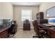 Bright home office with two desks, ample storage, and comfortable seating at 309 Mystic Falls Dr, Apollo Beach, FL 33572