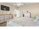 Main bedroom with a dresser, king-size bed, and access to the bathroom at 309 Mystic Falls Dr, Apollo Beach, FL 33572