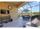 Spacious screened patio with comfortable seating and outdoor entertainment area at 309 Mystic Falls Dr, Apollo Beach, FL 33572