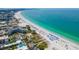 Aerial view of a beautiful beach front condos on a white sand beach with crystal clear water at 400 64Th Ave # 908, St Pete Beach, FL 33706