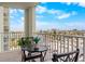 Relaxing balcony with seating area and stunning city and water views at 400 64Th Ave # 908, St Pete Beach, FL 33706