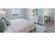 Bright bedroom with calming decor and a beautiful water view at 400 64Th Ave # 908, St Pete Beach, FL 33706