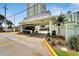 Community entrance showcasing manicured landscaping and clear signage at 400 64Th Ave # 908, St Pete Beach, FL 33706