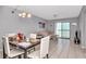 Dining area with table and chairs, view of kitchen and living room at 5004 Terrace Palms Cir # 201, Tampa, FL 33617