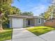 House exterior with driveway and landscaping at 6904 E 18Th Ave, Tampa, FL 33619