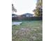 Large backyard with a partially constructed patio at 8218 N 18Th St, Tampa, FL 33604