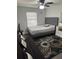 Cozy bedroom with a queen bed, ceiling fan, and dark rug at 8218 N 18Th St, Tampa, FL 33604