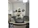 Glass-top dining table with seating for four in a bright space at 8218 N 18Th St, Tampa, FL 33604