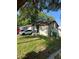 This charming house boasts a large grassy yard at 8218 N 18Th St, Tampa, FL 33604