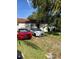 Well-maintained home with a grassy yard and off-street parking at 8218 N 18Th St, Tampa, FL 33604