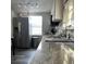 Granite countertops and stainless steel appliances in this kitchen at 8218 N 18Th St, Tampa, FL 33604