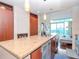 Granite countertop kitchen island with stainless steel appliances at 111 N 12Th St # 1708, Tampa, FL 33602