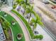 Landscaped courtyard with palm trees, walking paths, and seating areas at 111 N 12Th St # 1708, Tampa, FL 33602