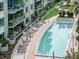 Luxury condo building with a resort-style pool and patio area at 111 N 12Th St # 1708, Tampa, FL 33602