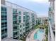 Luxury condo building with resort-style pool and lush landscaping at 111 N 12Th St # 1708, Tampa, FL 33602