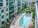 Luxury condo building with a resort-style pool and surrounding patio at 111 N 12Th St # 1708, Tampa, FL 33602
