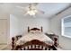 Well-lit bedroom with a full-size bed and window coverings at 114 Wintersong Ln, Sun City Center, FL 33573