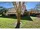 Townhouse exterior with landscaping and walkway at 11822 Raintree Dr, Temple Terrace, FL 33617