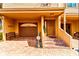 Exterior shot of townhome featuring a one-car garage and an inviting front entrance at 1710 Lighthouse S Ter # 1, South Pasadena, FL 33707