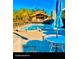 An outdoor pool and clubhouse at 1710 Lighthouse S Ter # 1, South Pasadena, FL 33707