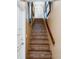 A stairway with tile steps and handrail at 1710 Lighthouse S Ter # 1, South Pasadena, FL 33707