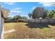 Large backyard with wooden fence and storage shed at 1711 Patlin S Cir, Largo, FL 33770