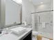 Bathroom with walk-in shower, grab bars, and modern vanity at 18017 Pine Hammock Blvd, Lutz, FL 33548