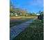 Residential street view with sidewalk and landscaping at 2152 74Th N St, St Petersburg, FL 33710